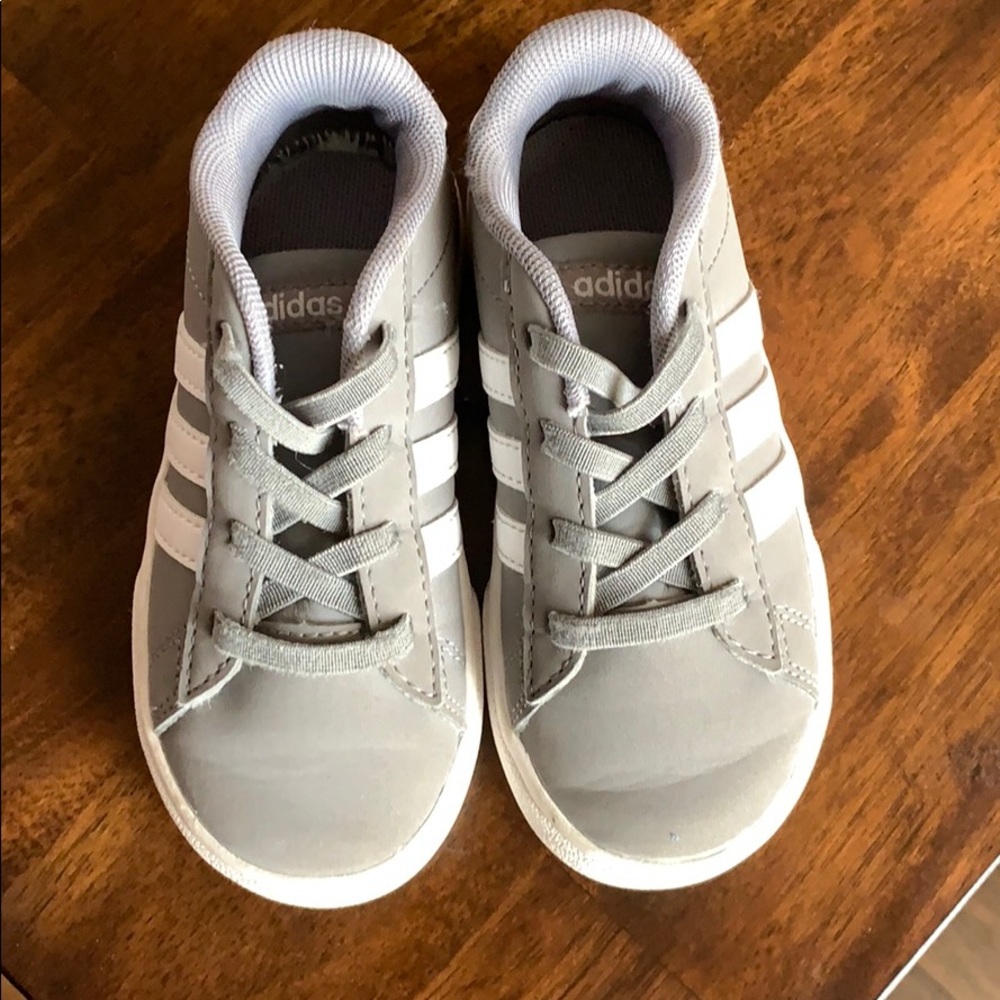 Little kid gray Adidas tennis shoes